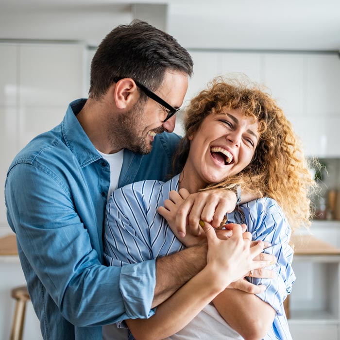 laughing middle aged couple