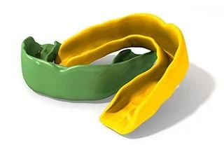 Two green and yellow mouthguards